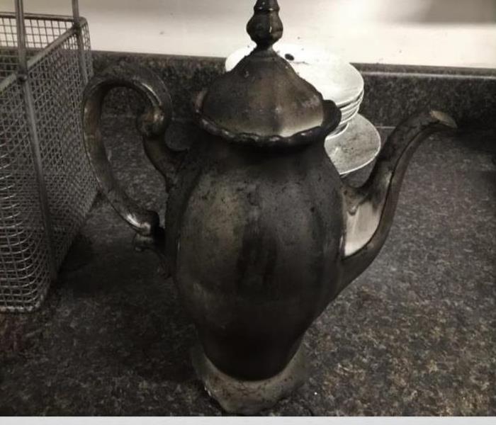 Smoke damaged teapot Pueblo fire